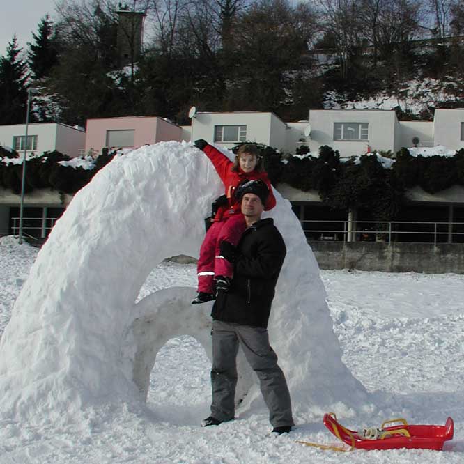 Julia & Juergen Schmidhuber 
constructing a snow arc