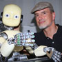 Juergen Schmidhuber and his iCub baby robot