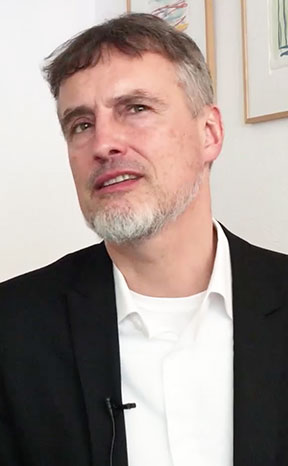 Juergen Schmidhuber 2019 being interviewed by Deutsche Bank at WEF = Davos
