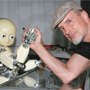 Juergen Schmidhuber and his iCub baby robot